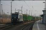 Die fr PRESS fahrende 185 547-7 ist mit einem leerem Holztransporter unterwegs (gesehen Oranienburg 25.02.2011)