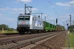 185 540-2  Kassel Huskies  TX Logistik AG im Dienst fr Raildox GmbH & Co. KG mit einem Holzzug in Friesack(Mark) in Richtung Neustadt(Dosse) unterwegs. 25.05.2011