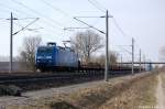 145 030-7 PRESS (145 085-7) mit leeren Holzzug zwischen Großwudicke und Rathenow in Richtung Rathenow unterwegs.