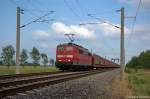 151 023-9 DB Schenker Rail Deutschland AG mit einem Opel Astra Autotransportzug bei Nennhausen und fuhr in Richtung weiter. 06.07.2012